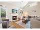 Cozy living room features a fireplace, comfortable seating, and a bright, airy atmosphere at 400 Pringle Dr, Suwanee, GA 30024