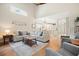 Spacious living room with hardwood floors, ample seating, and an open layout at 400 Pringle Dr, Suwanee, GA 30024