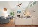Bright living room with vaulted ceiling, fireplace, built-in shelving, and hardwood floors at 400 Pringle Dr, Suwanee, GA 30024