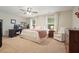 Spacious bedroom featuring dual windows, neutral walls, and carpeted floors at 400 Pringle Dr, Suwanee, GA 30024