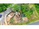 Overhead shot of a park playground with climbing equipment, swings, and protective ground cover at 400 Pringle Dr, Suwanee, GA 30024