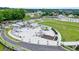 Aerial photograph featuring a town square with a performance area and a water feature at 400 Pringle Dr, Suwanee, GA 30024