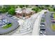Inviting town center with a pedestrian bridge, a well-manicured lawn, and parking at 400 Pringle Dr, Suwanee, GA 30024