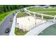 Overhead view of a community volleyball court next to a pedestrian bridge and water feature at 400 Pringle Dr, Suwanee, GA 30024