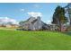 Large backyard showcasing a well-maintained lawn and ample space for recreation at 4497 Black Water Cv, Ellenwood, GA 30294