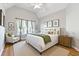 Bedroom with bright, natural light and neutral tones at 4497 Black Water Cv, Ellenwood, GA 30294