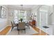 Formal dining room featuring modern light fixture and an elegant rug at 4497 Black Water Cv, Ellenwood, GA 30294