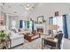 Inviting living room featuring a fireplace, vaulted ceiling, and bright, natural light at 4497 Black Water Cv, Ellenwood, GA 30294