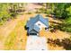 Aerial view of farmhouse style house with large drive and oversized private lot at 90 Ayers Rd, Bowdon, GA 30108