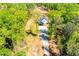 Aerial view of new construction home with attached garage on land with driveway leading to the road at 90 Ayers Rd, Bowdon, GA 30108