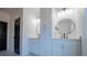 Bathroom with double vanity, marble floors and black fixtures at 90 Ayers Rd, Bowdon, GA 30108