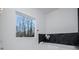 Bright bathroom featuring a large window and a soaking tub at 90 Ayers Rd, Bowdon, GA 30108