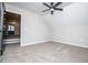Cozy bedroom featuring plush carpeting and a modern ceiling fan, providing comfort and style at 90 Ayers Rd, Bowdon, GA 30108