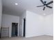Bedroom features a ceiling fan, plush carpet and an open doorway to the hallway at 90 Ayers Rd, Bowdon, GA 30108