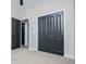 Cozy bedroom showing closet doors, natural light and plush neutral carpet at 90 Ayers Rd, Bowdon, GA 30108