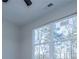 Bright bedroom with large window, ceiling fan, and neutral paint at 90 Ayers Rd, Bowdon, GA 30108
