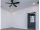 Bedroom features a ceiling fan, plush carpet and an open doorway to another room at 90 Ayers Rd, Bowdon, GA 30108