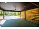Spacious covered parking area featuring recessed lights, a ceiling fan, and a wood accent wall at 90 Ayers Rd, Bowdon, GA 30108