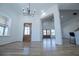 Entryway with hardwood floors, bright lighting, and open access to dining area at 90 Ayers Rd, Bowdon, GA 30108