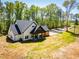 Wide angle shot of the home and landscaping on a sunny day at 90 Ayers Rd, Bowdon, GA 30108