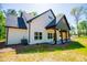 View of siding, covered patio, and landscaping at 90 Ayers Rd, Bowdon, GA 30108