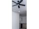 Upstairs hallway featuring a pendant light fixture, a wood railing with iron spindles, and plush carpet at 90 Ayers Rd, Bowdon, GA 30108