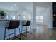 Kitchen bar with seating provides easy access to nearby living and dining areas at 90 Ayers Rd, Bowdon, GA 30108