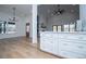 Kitchen with white cabinets and drawers, connecting to the bright, spacious living area at 90 Ayers Rd, Bowdon, GA 30108