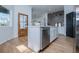 Charming kitchen boasts stainless appliances, center island, hardwood floors and a wood trimmed door at 90 Ayers Rd, Bowdon, GA 30108