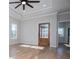 Bright living room features hardwood floors, recessed lighting, and a ceiling fan at 90 Ayers Rd, Bowdon, GA 30108