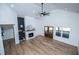 Spacious living room with hardwood floors, vaulted ceilings, and a decorative fireplace mantel at 90 Ayers Rd, Bowdon, GA 30108