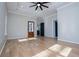 Open living space with hardwood floors, recessed lighting and a ceiling fan at 90 Ayers Rd, Bowdon, GA 30108