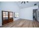 Open living room boasts high ceilings, hardwood floors, and lots of natural light from beautiful windows at 90 Ayers Rd, Bowdon, GA 30108