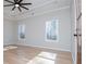 Spacious bedroom boasts hardwood floors, tray ceilings, and a wooden entry door at 90 Ayers Rd, Bowdon, GA 30108