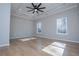 Spacious bedroom with hardwood floors, tray ceilings and a modern ceiling fan at 90 Ayers Rd, Bowdon, GA 30108