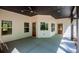 Inviting covered patio with multiple entry doors, perfect for outdoor relaxation at 90 Ayers Rd, Bowdon, GA 30108