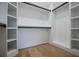 Spacious walk-in closet with ample shelving and black bars, providing functional storage solutions at 90 Ayers Rd, Bowdon, GA 30108