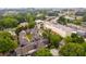 Aerial view of the townhome community with surrounding greenery and close proximity to the city at 1516 Howell Mill Nw Rd # 16, Atlanta, GA 30318