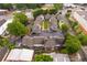 Aerial view showing the layout of the townhome community and parking spots with green space at 1516 Howell Mill Nw Rd # 16, Atlanta, GA 30318
