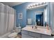 Bright bathroom featuring a shower and vanity with a mirror, adjacent to the bedroom at 1516 Howell Mill Nw Rd # 16, Atlanta, GA 30318