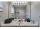 Bathroom featuring a white vanity with a large mirror, sink, and modern faucet with storage baskets at 1516 Howell Mill Nw Rd # 16, Atlanta, GA 30318