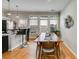 Well-lit dining area features hardwood floors, a stylish pendant, and views of the outdoor at 1516 Howell Mill Nw Rd # 16, Atlanta, GA 30318