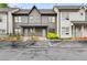 Well-maintained townhome exterior with reserved parking and manicured green spaces at 1516 Howell Mill Nw Rd # 16, Atlanta, GA 30318