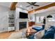 Bright living room with hardwood floors, fireplace, and modern shelving at 1516 Howell Mill Nw Rd # 16, Atlanta, GA 30318
