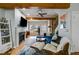 Comfortable living room with fireplace, hardwood flooring, and access to outdoor views at 1516 Howell Mill Nw Rd # 16, Atlanta, GA 30318