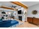 Inviting living room with fireplace, hardwood floors, and a modern ceiling fan at 1516 Howell Mill Nw Rd # 16, Atlanta, GA 30318
