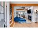 Bright living area with hardwood floors, fireplace, and access to a staircase at 1516 Howell Mill Nw Rd # 16, Atlanta, GA 30318