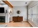 Cozy living room featuring a fireplace, console, and abundant natural light at 1516 Howell Mill Nw Rd # 16, Atlanta, GA 30318