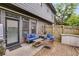 Back patio featuring gray siding, a furniture set, privacy fence, and outdoor storage unit at 1516 Howell Mill Nw Rd # 16, Atlanta, GA 30318