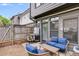Back patio showing outdoor furniture set, privacy fence, and gray exterior siding at 1516 Howell Mill Nw Rd # 16, Atlanta, GA 30318